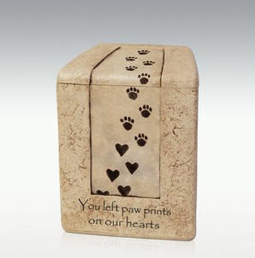 Tan pet urn with paw prints, hearts, and the inscription 