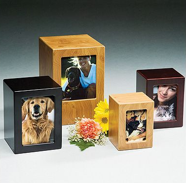 Wooden pet urns with photo frames, various sizes and finishes.