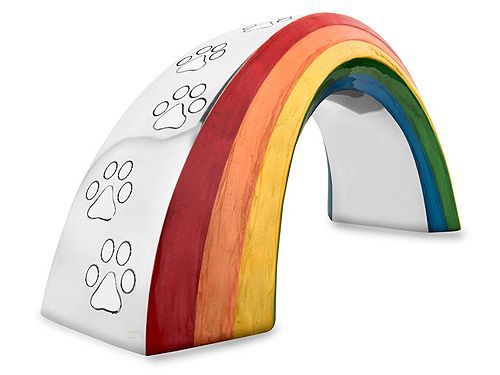 Rainbow-shaped pet memorial with paw prints, silver with painted rainbow colors.