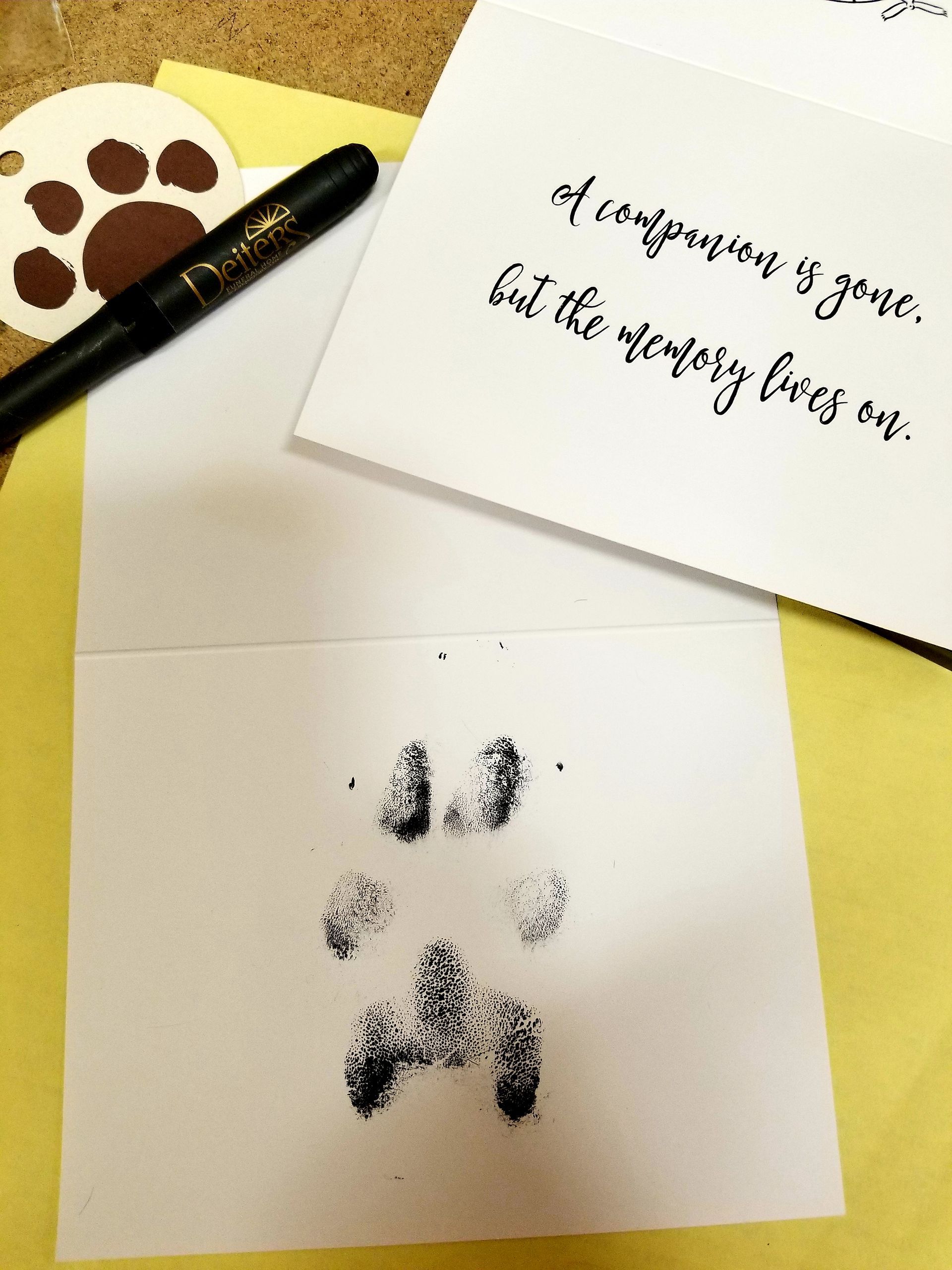 Paw print card with a message: 