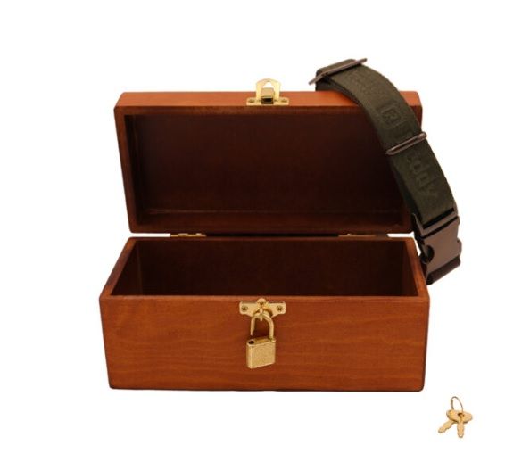 Wooden box with open lid, gold latch, padlock, strap, and two keys.