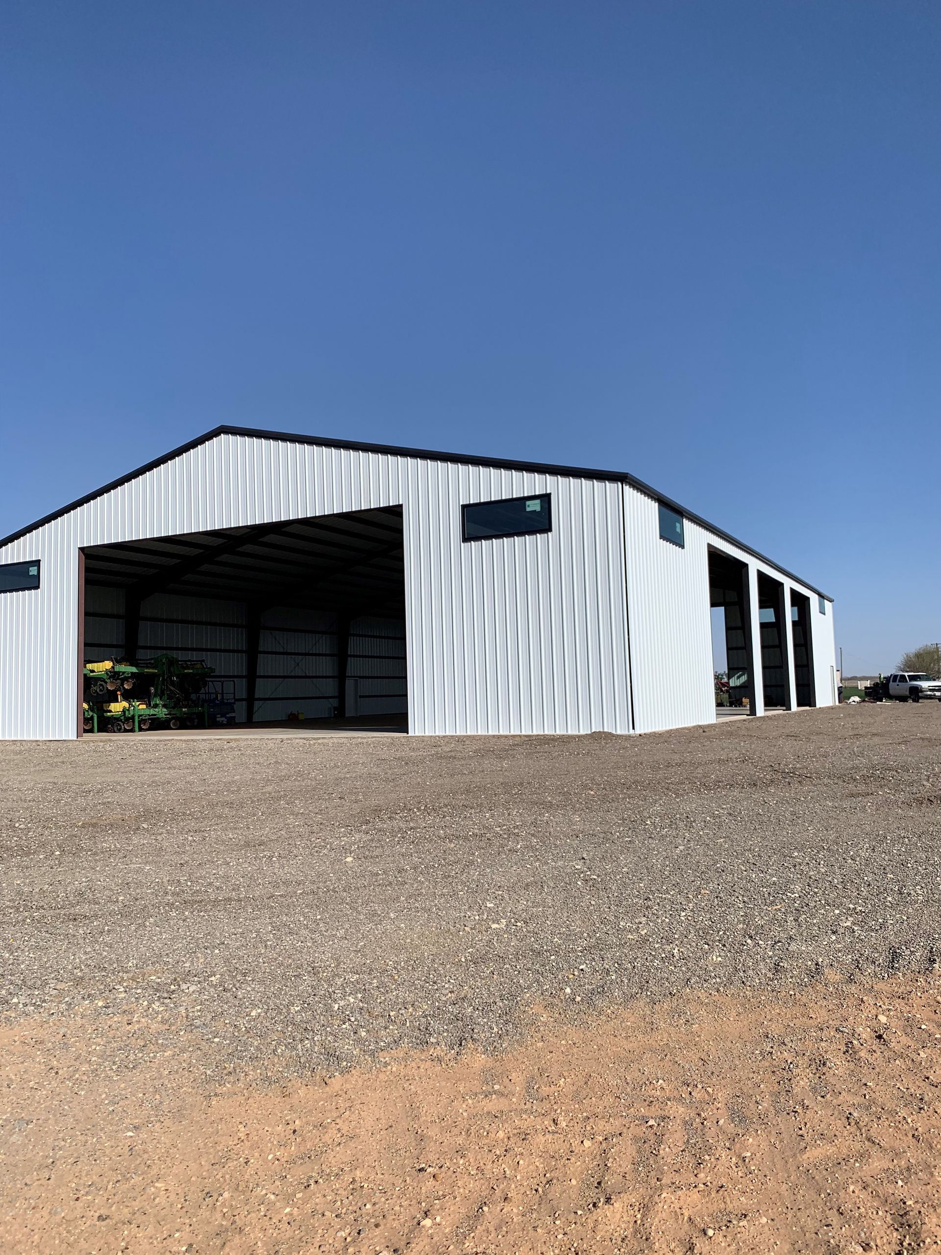 large white metal barn