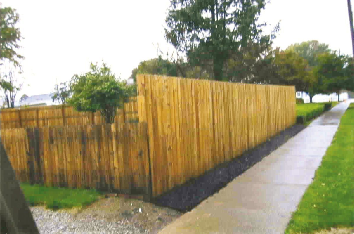 Wooden fence around backyard perimeter