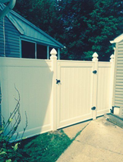 White vinyl fence with gate