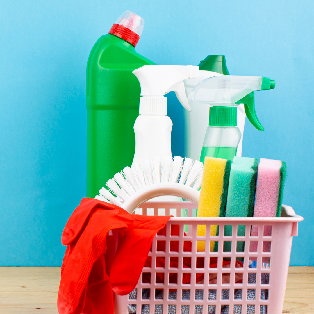 cleaning materials and tools  in pink basket