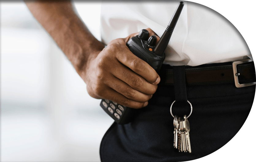 A day porter holding a radio for security