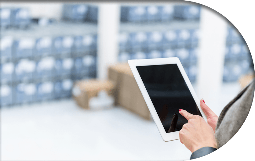 An employee handling organized inventory with her tablet