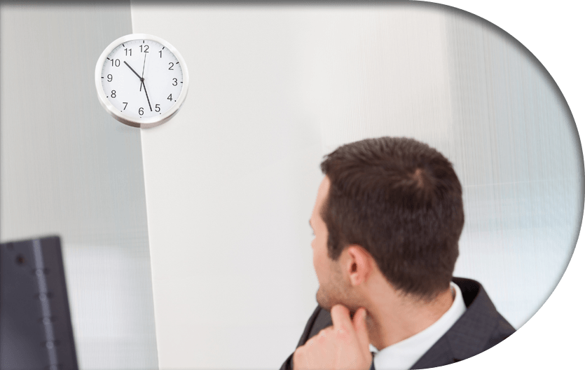 An office employee looking at the clock