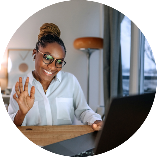 young smiling well dressed businesswoman having video call while working from home office