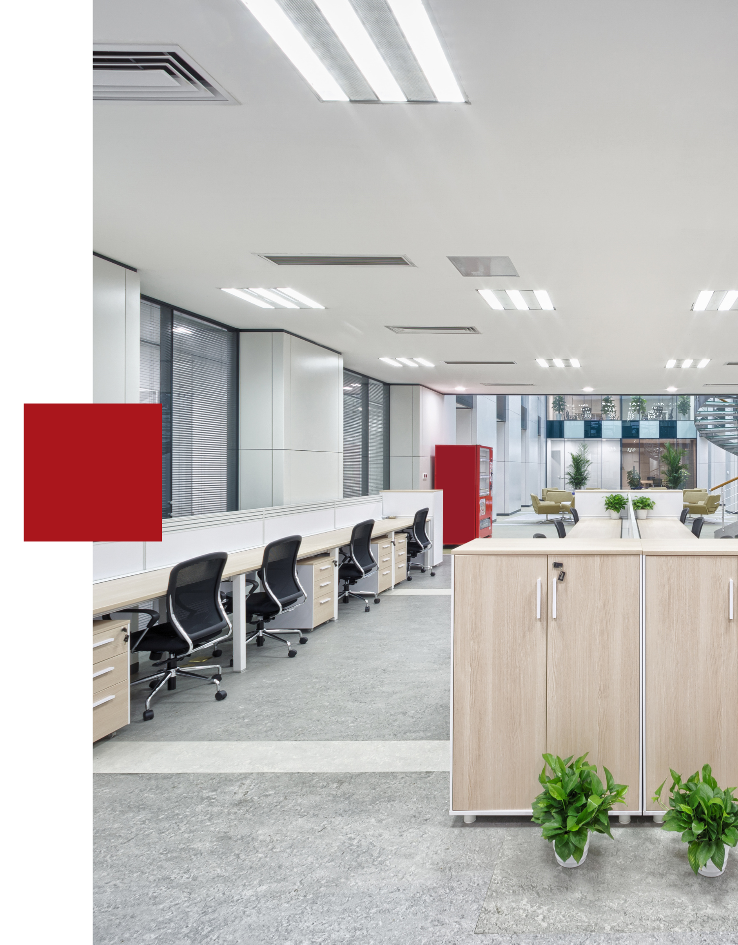 A large office with a lot of desks and chairs