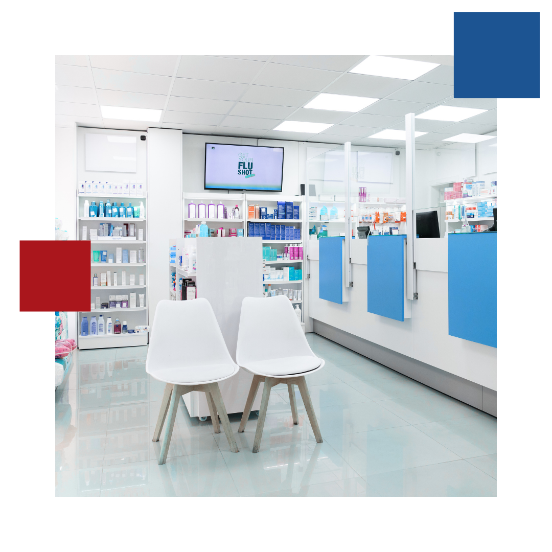 There are two chairs in the waiting area of a pharmacy.