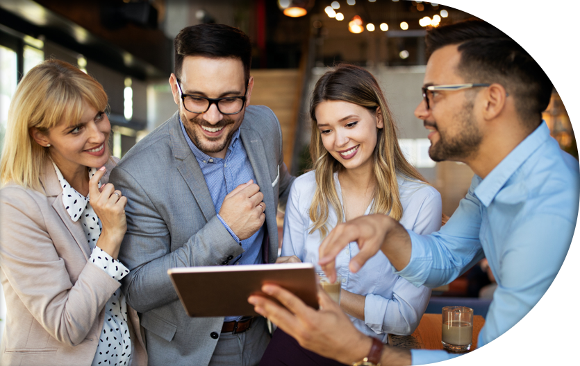 Smiling employees brainstorming in their office