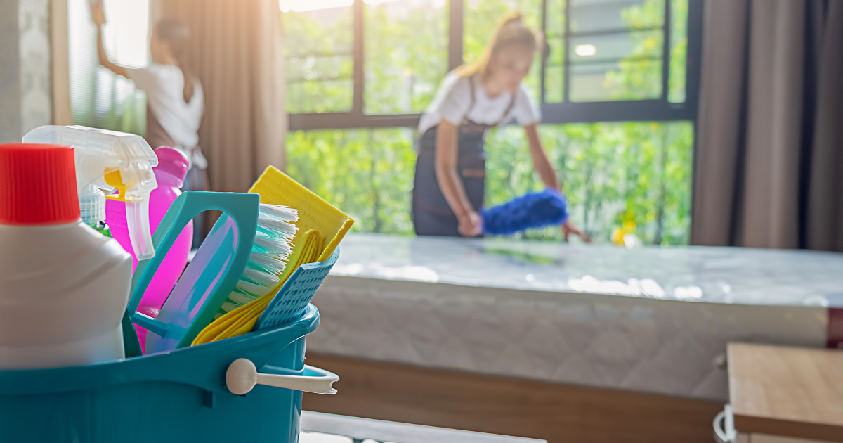 professional cleaning service team cleaning the room