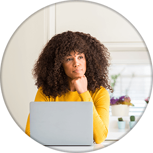 woman using computer laptop with serious face thinking about question