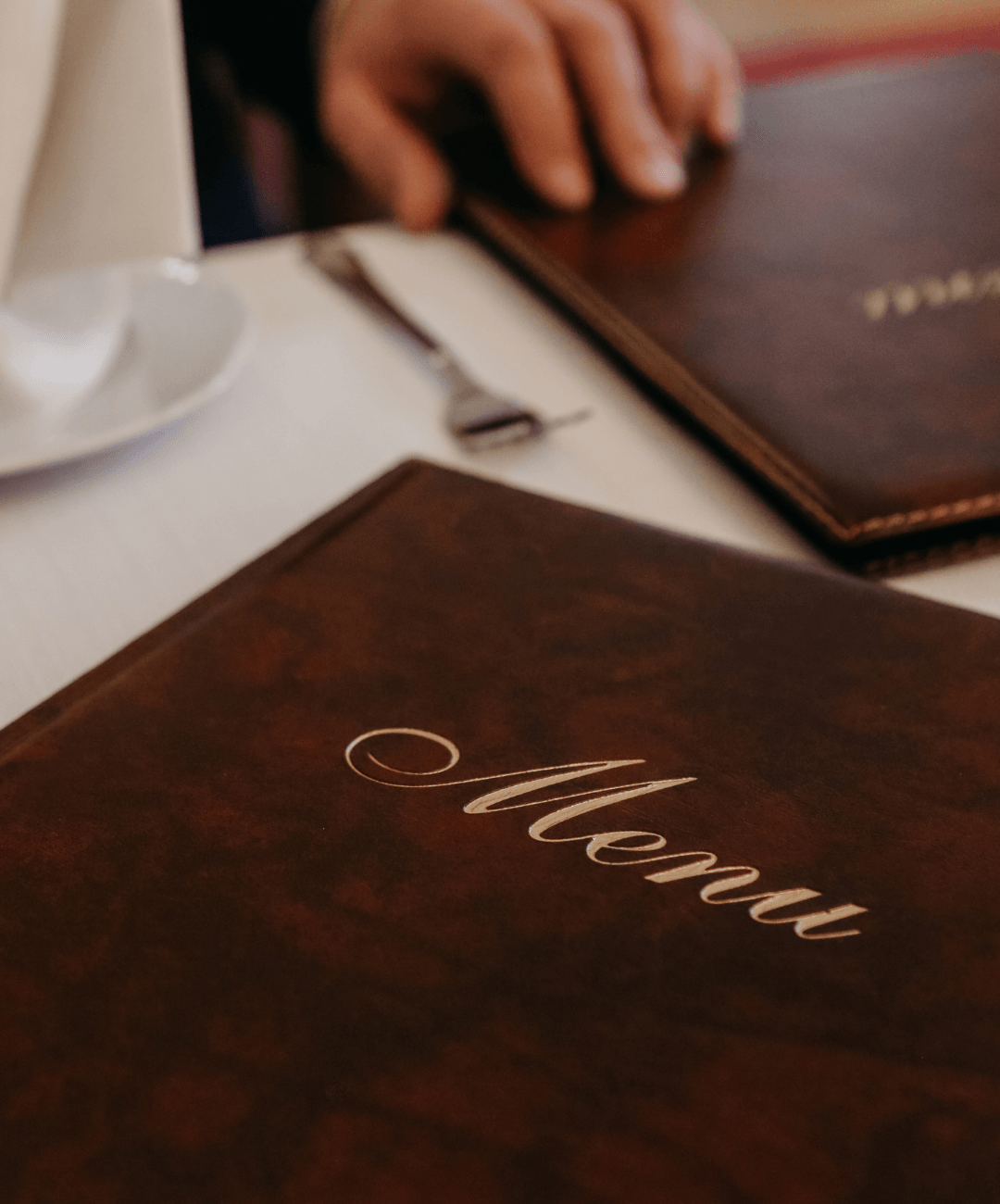 Man in restaurant reading the menu