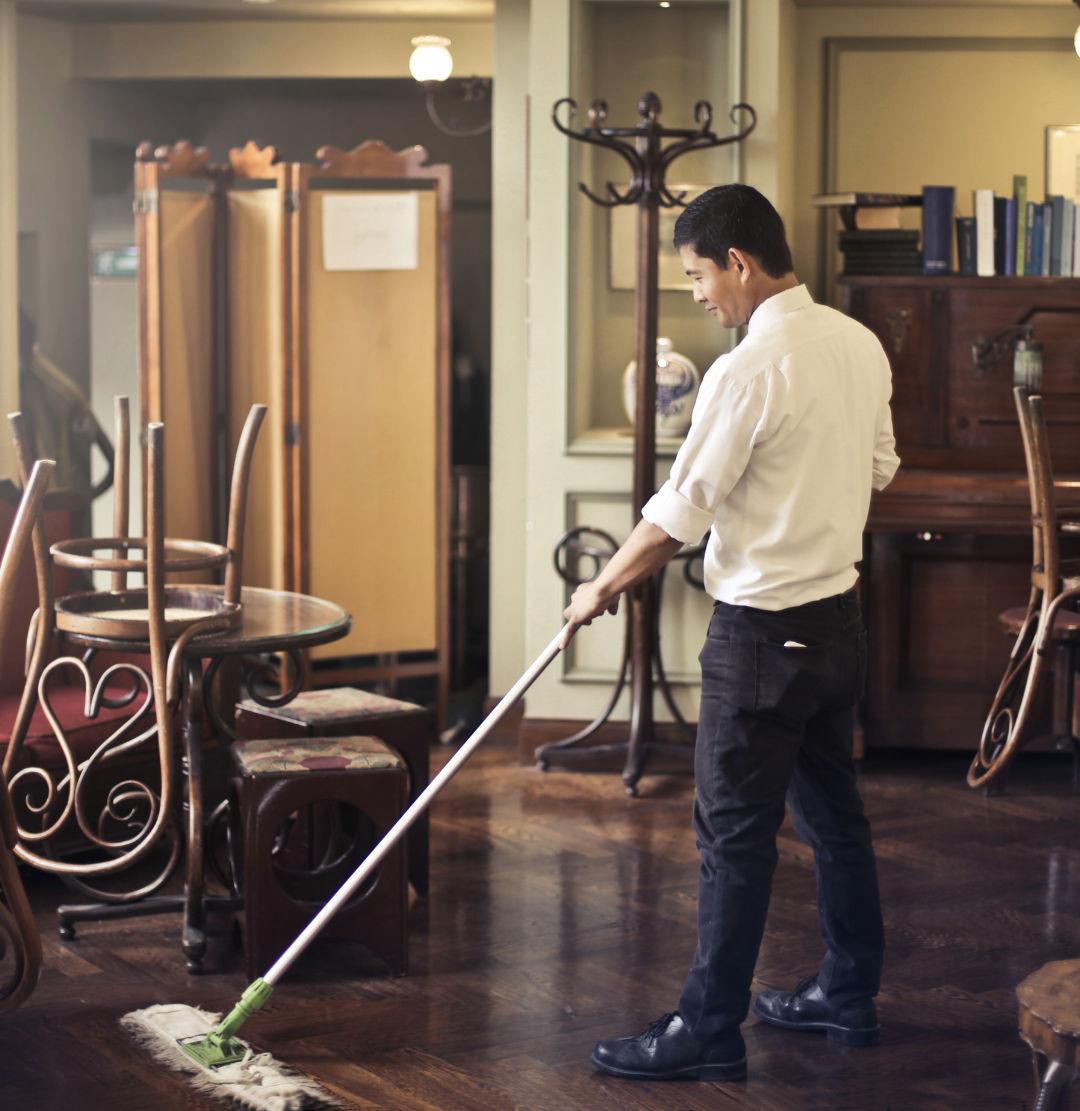 Restaurant staff mopping floor