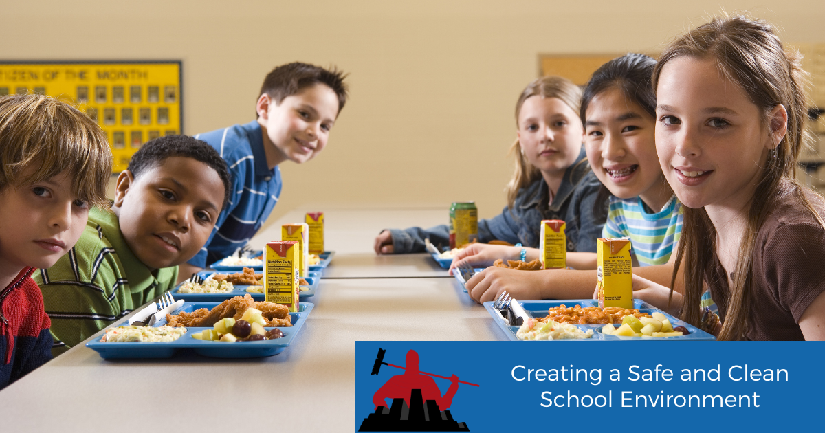 Students eating lunch at a cafeteria smiling at the camera