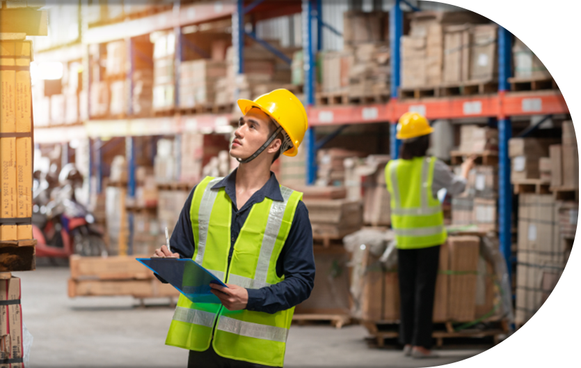 warehouse worker checking packages on shelf