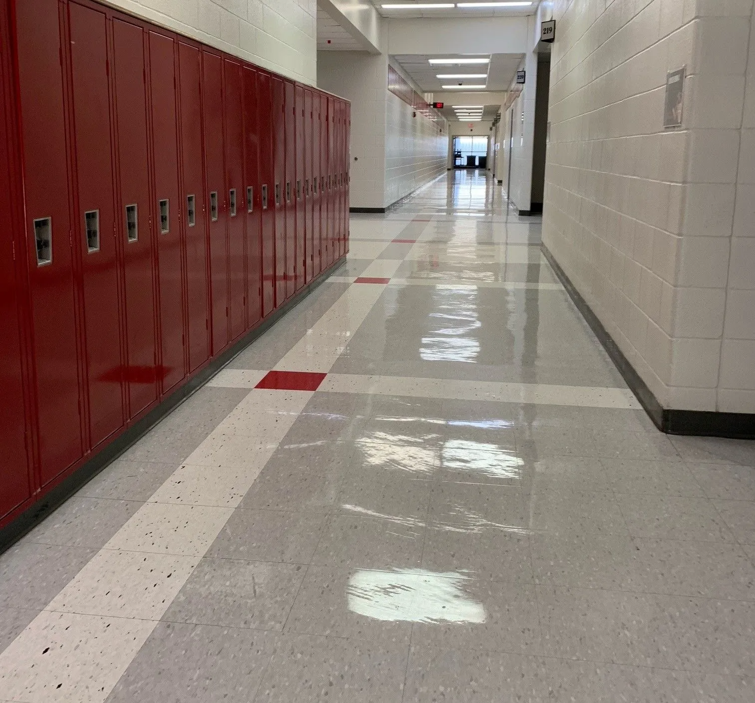 School hallway with a freshly waxed, shiny floor