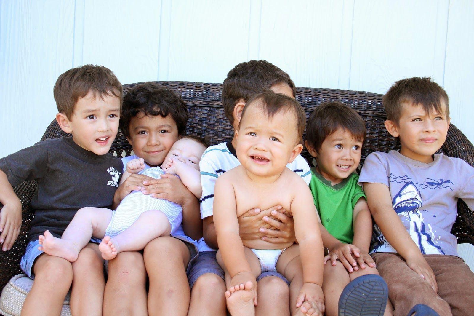 Children's faces are filled with joy as they smile brightly.