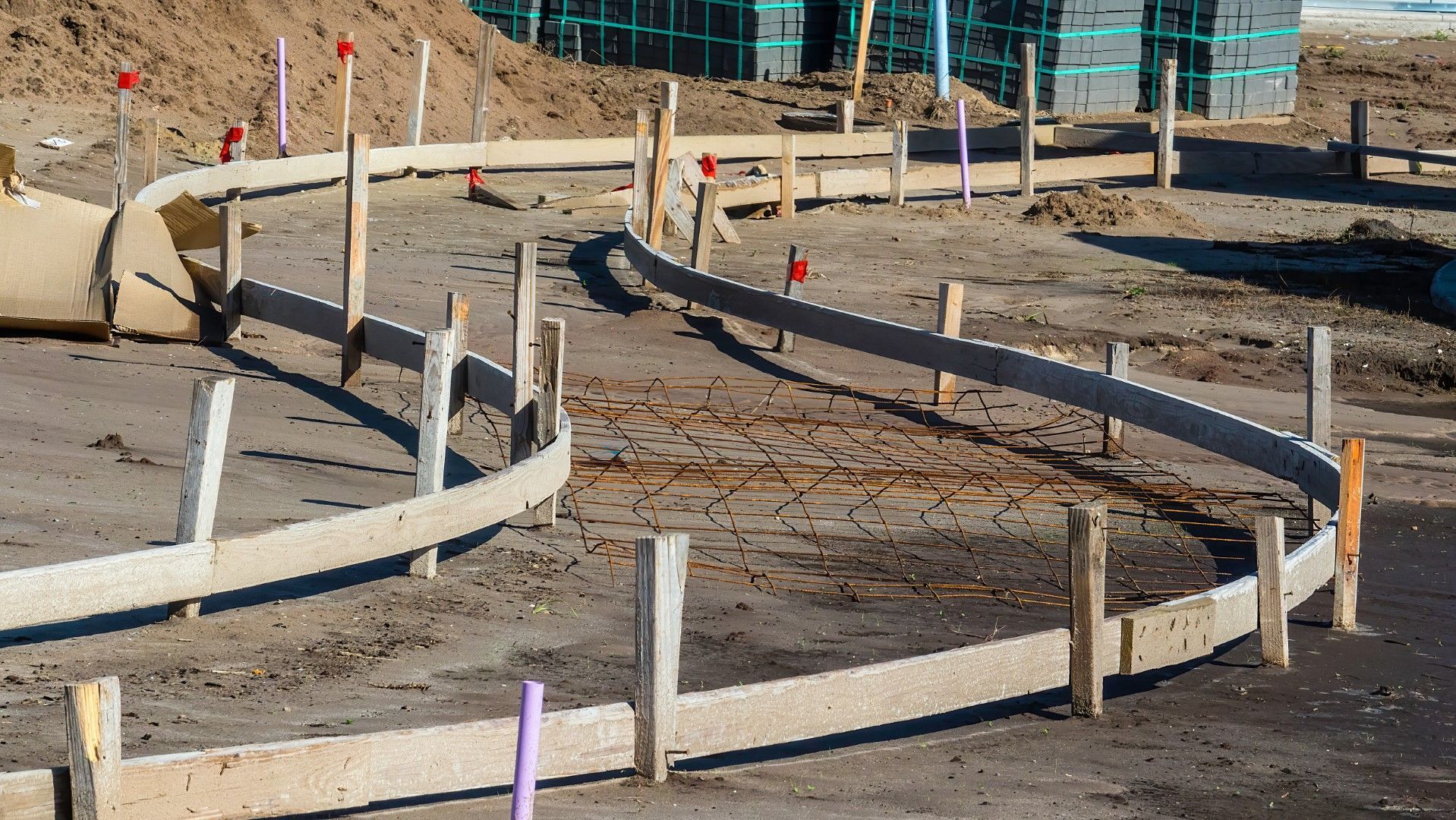 A construction site with a wooden fence around it.