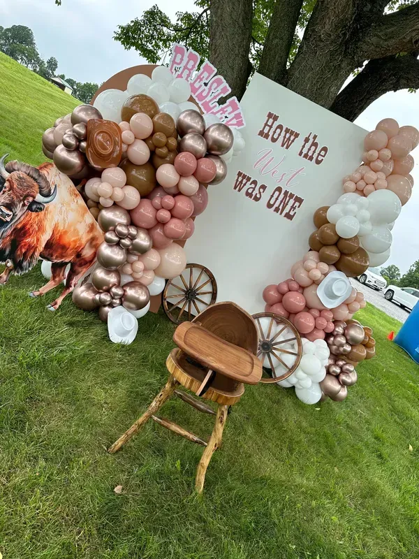 Pink and tan balloon arch with