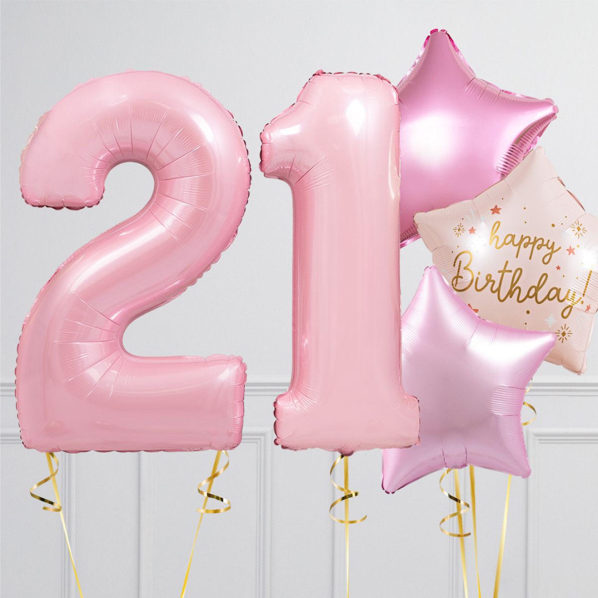 Pink “21” birthday balloons with a “Happy Birthday” star balloon on a light background