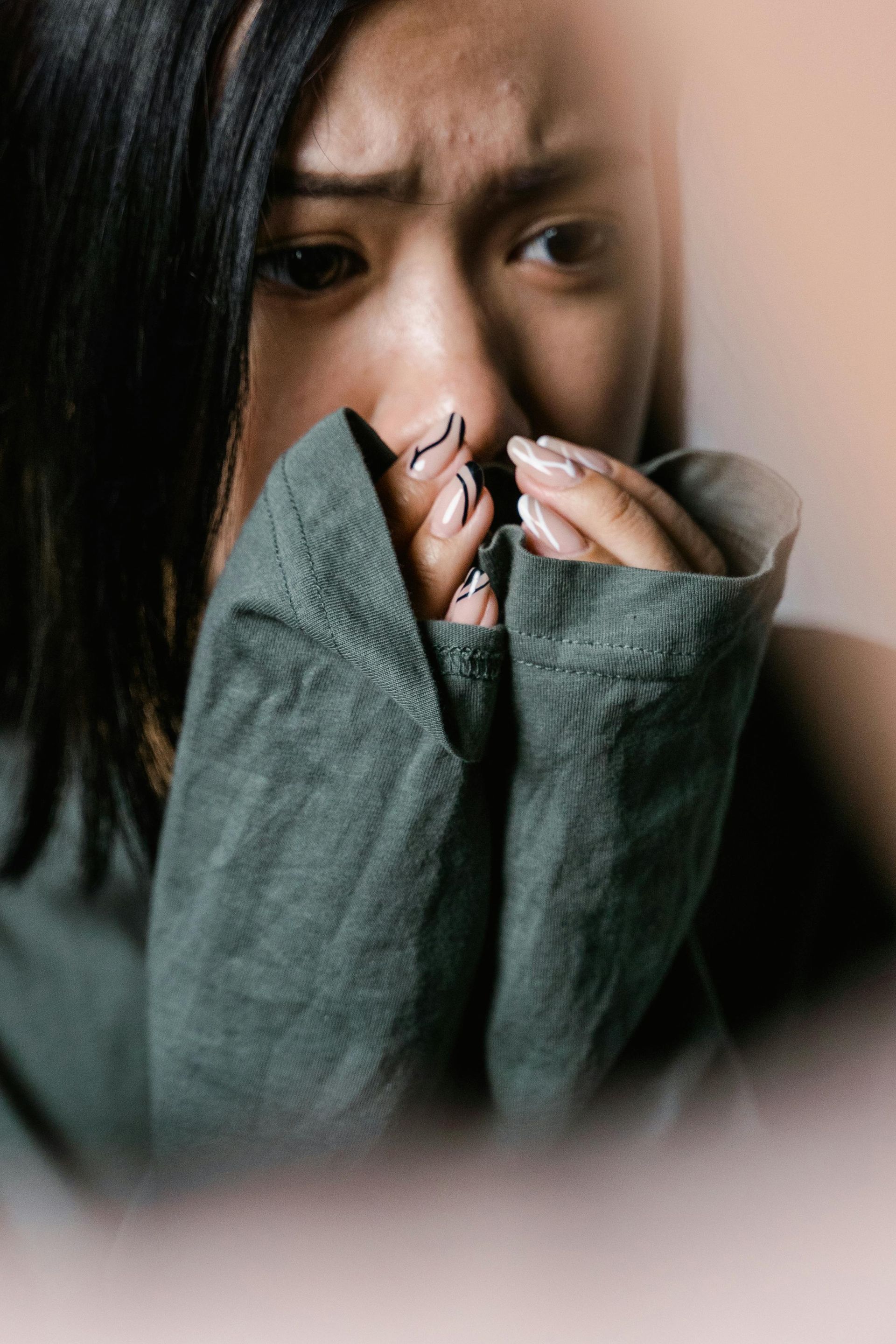 Person looking confused and conflicted in relationship, representing the complex emotions of trauma 