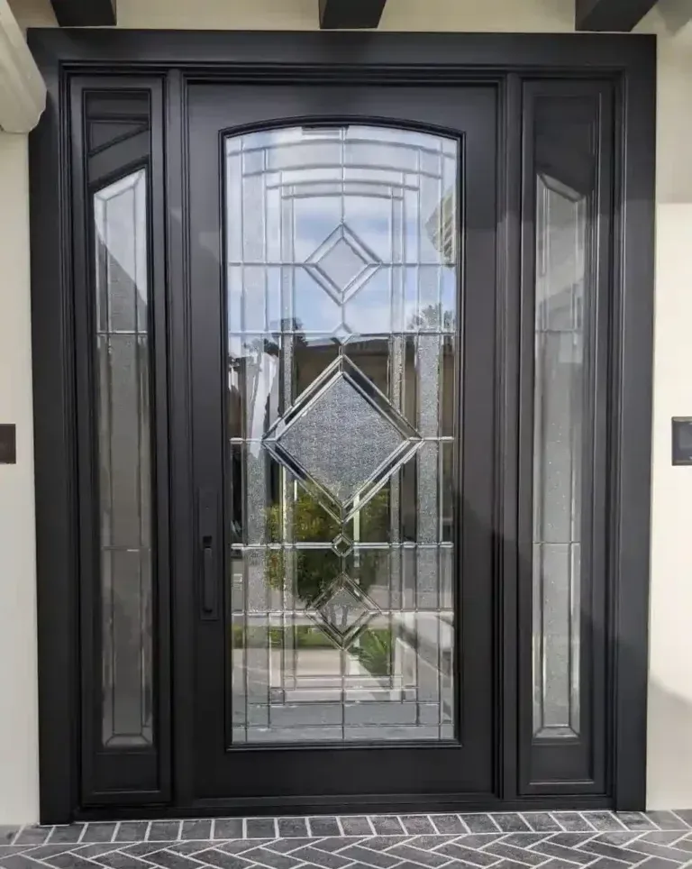 Black front door with decorative glass panels and sidelights at a home entrance