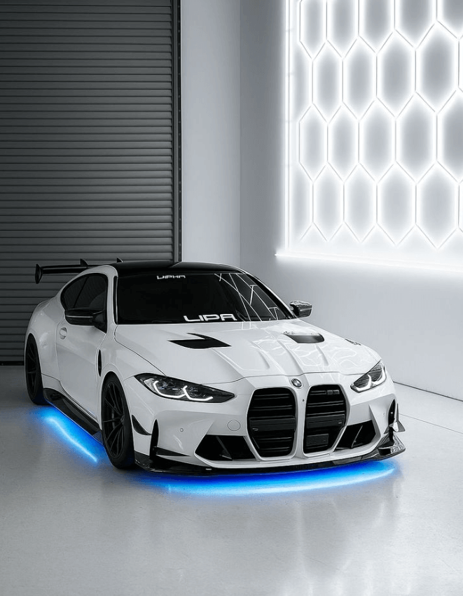 White sports car with blue RGB underglow lighting illuminating the floor in a modern showroom.