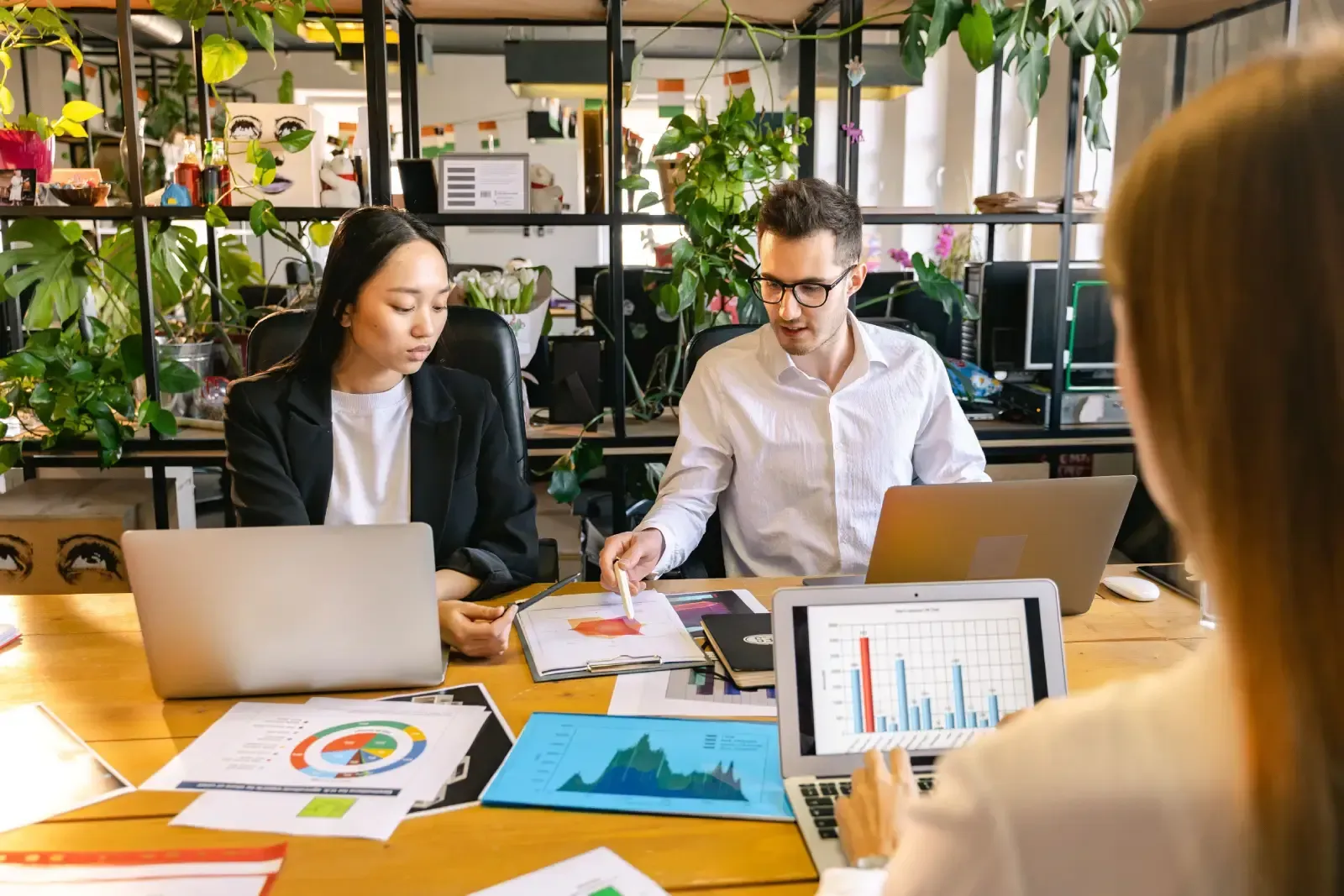 Professional team collaborating on social media marketing strategy