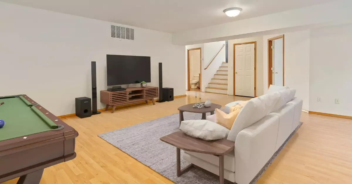 Finished basement with sectional sofa, TV setup, pool table, and modern basement furniture for entertainment and relaxation