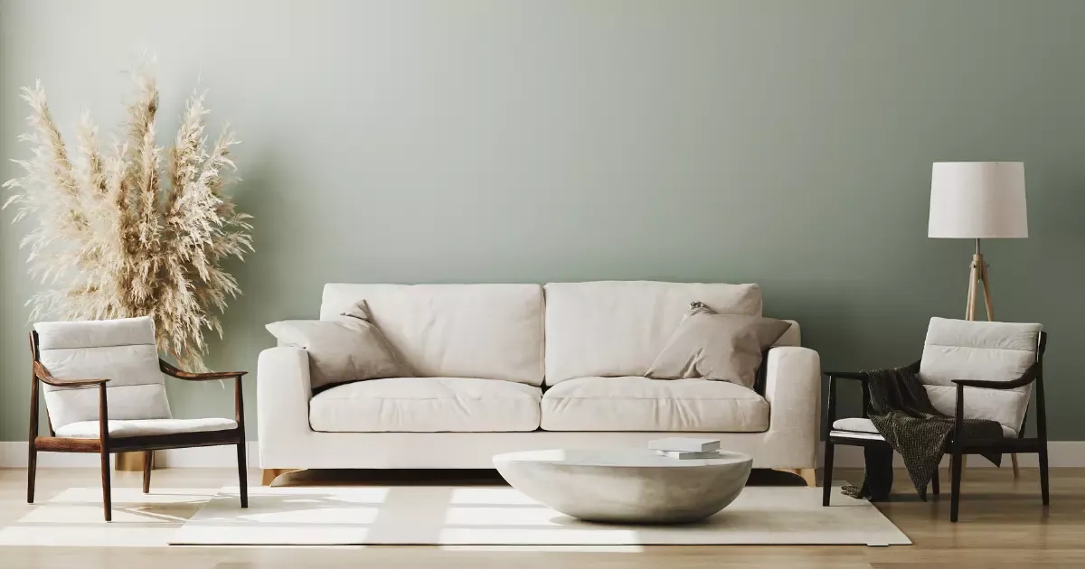 Modern neutral-toned space with a beige sofa and a round coffee table, showcasing cozy living room design ideas