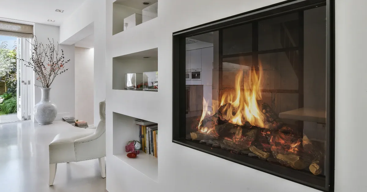 Modern white living space with sleek built-in fireplace installation and warm glowing flames