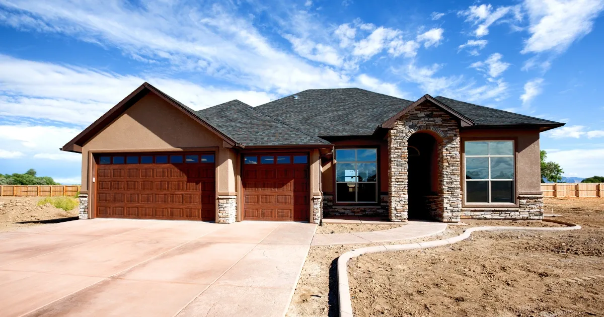 Newly built suburban single-family home with garage and driveway
