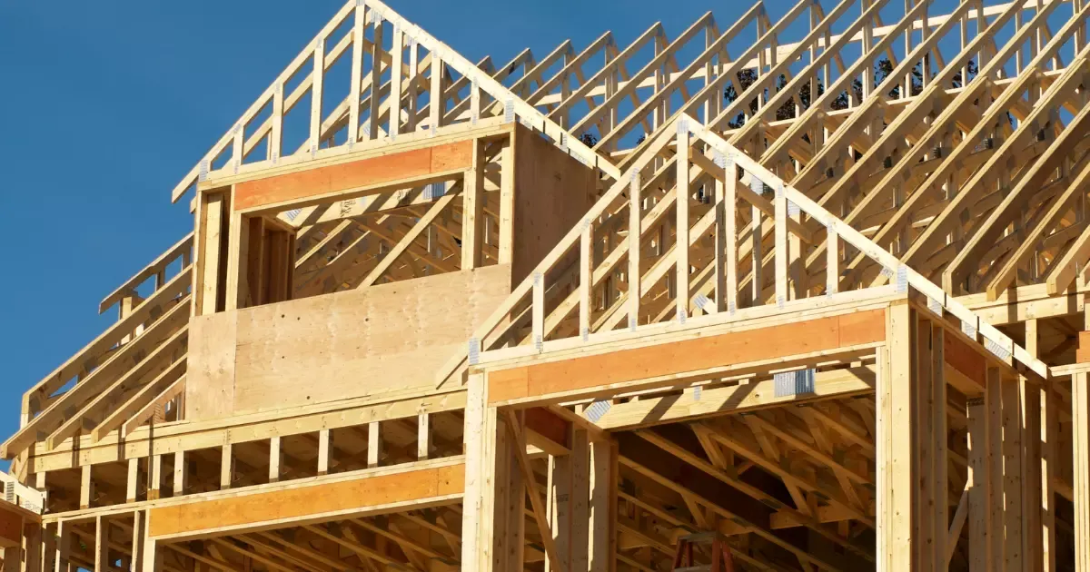 Wooden framing and roof trusses of a new home build during a house construction renovation project