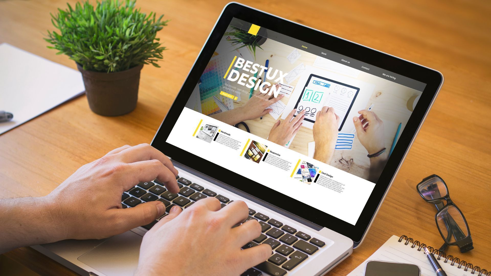 A person is typing on a laptop computer.