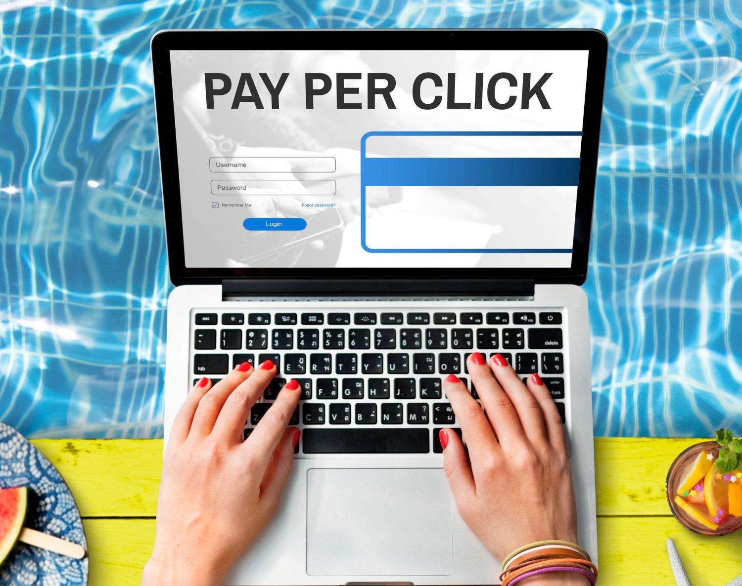 A woman is typing on a laptop with the words pay per click on the screen