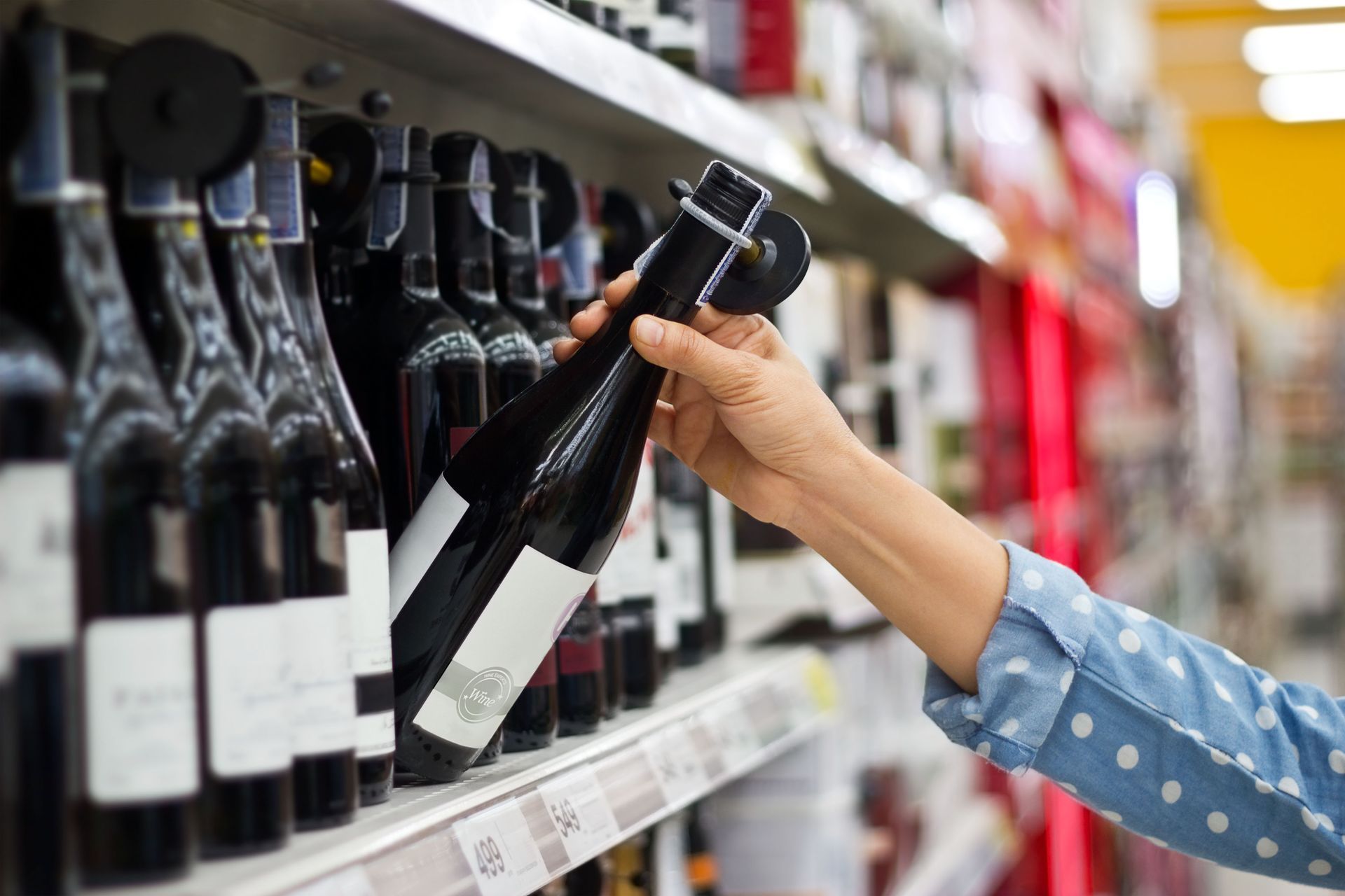 A person holding a bottle of wine | Liquor Shop in Tiger GA