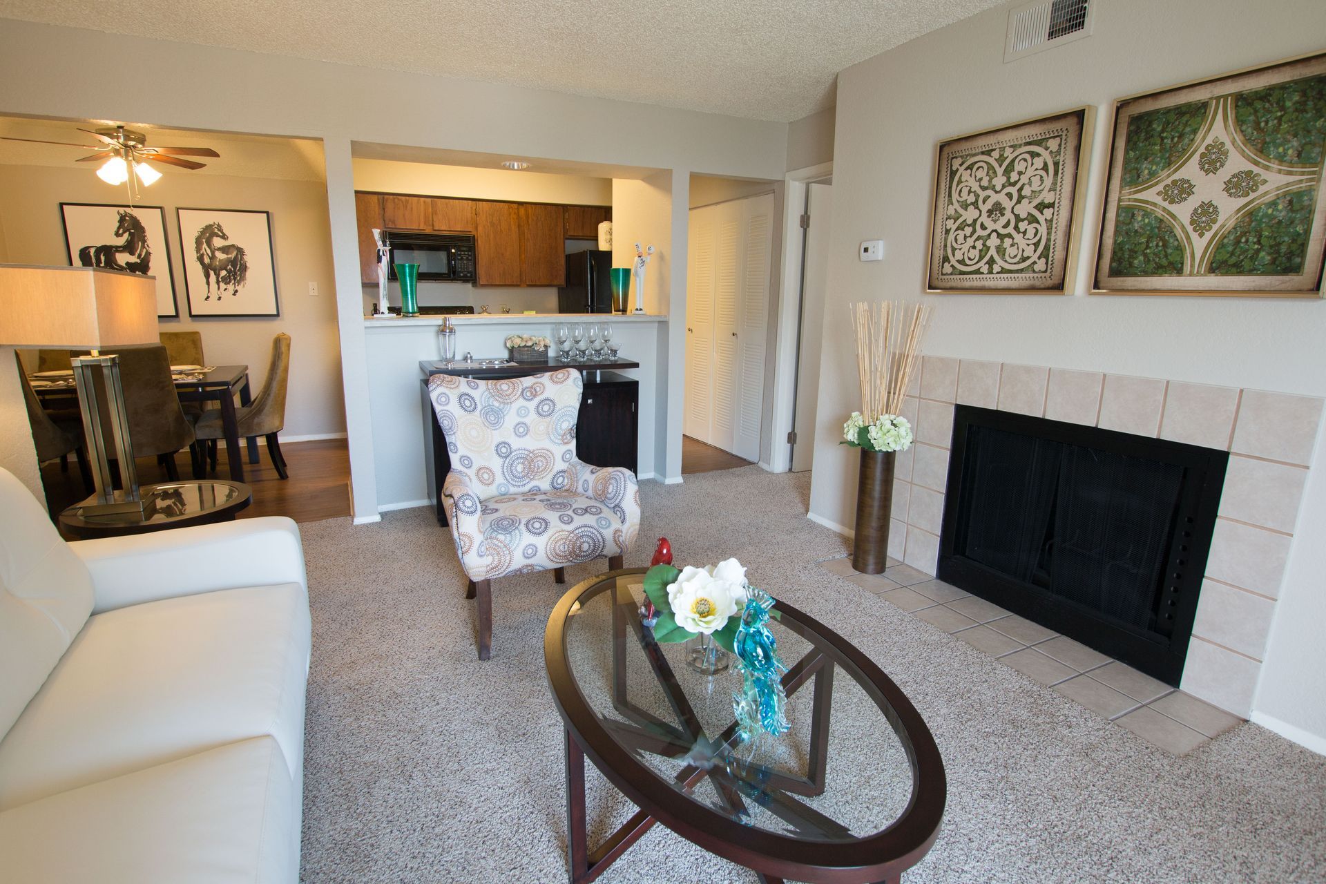 A living room with a fireplace and a couch