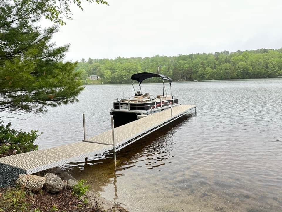 Dock in a lake with ramp up to the land