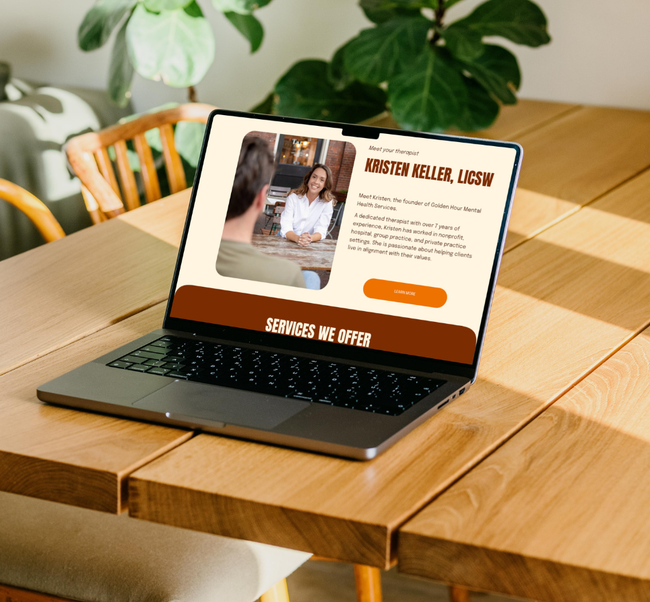 Laptop on wooden table displaying a wellness website in a bright room with plants