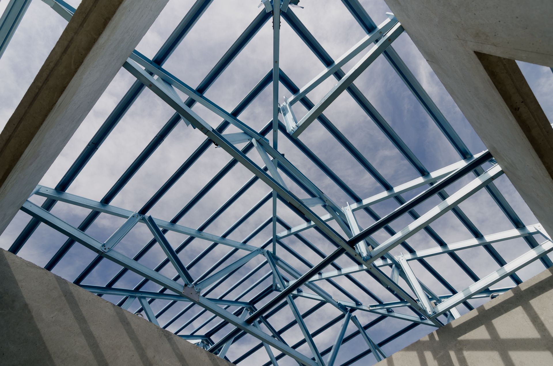 Looking up at the roof of a building under construction