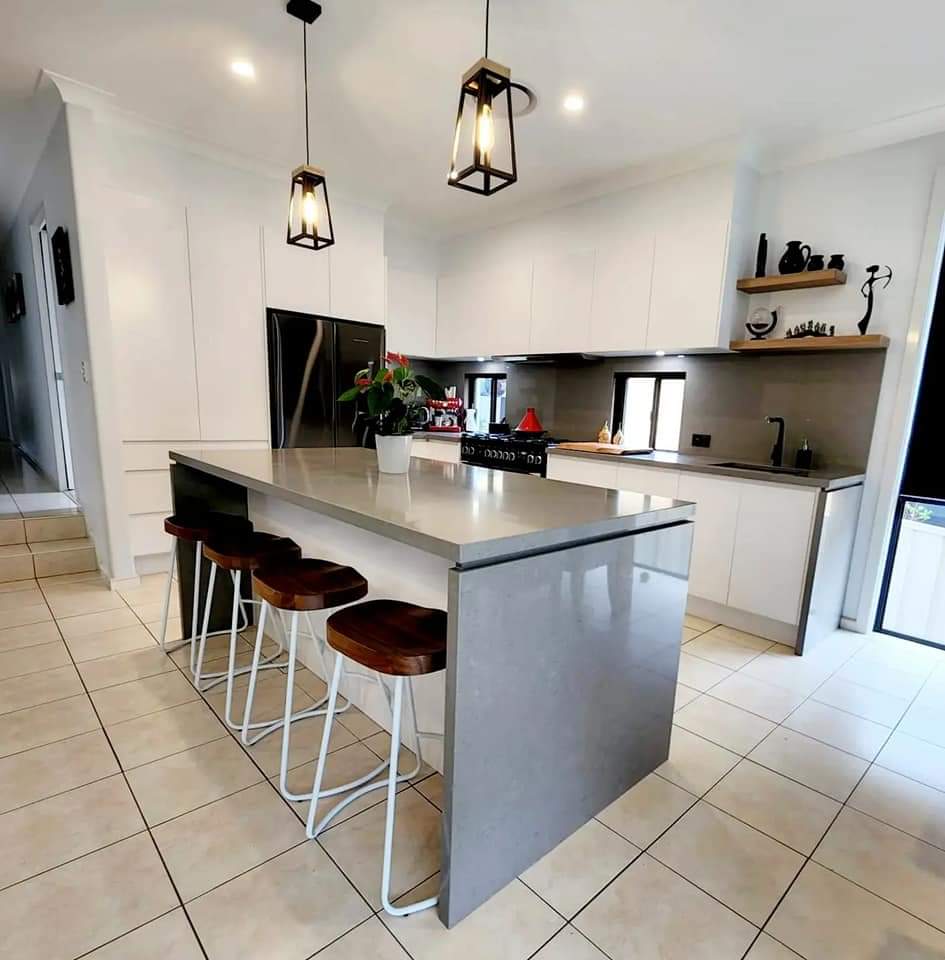 Grey Soft Stone Kitchen Island With White And Mahogany Stools  — DMB Kitchens in Port Macquarie, NSW