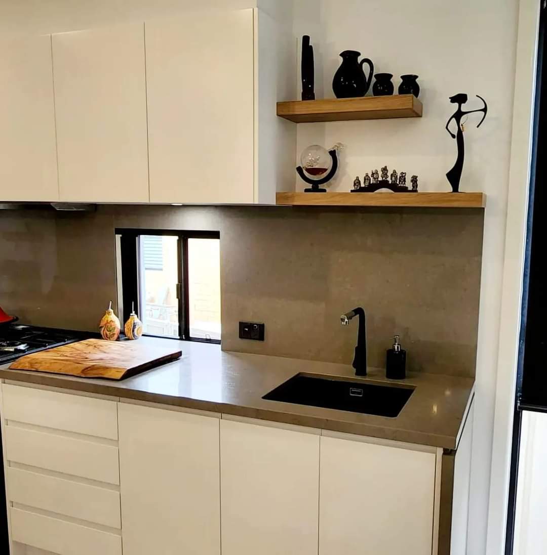 Grey Stone Kitchen Back Splash With Storage Cabinetry And Black Square Basin — DMB Kitchens in Port Macquarie, NSW