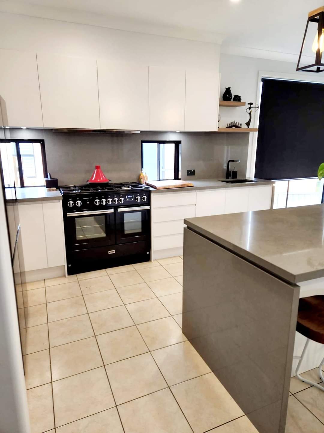 White Storage Cabinetry With Large Commercial Oven And Grey Stone Island — DMB Kitchens in Port Macquarie, NSW