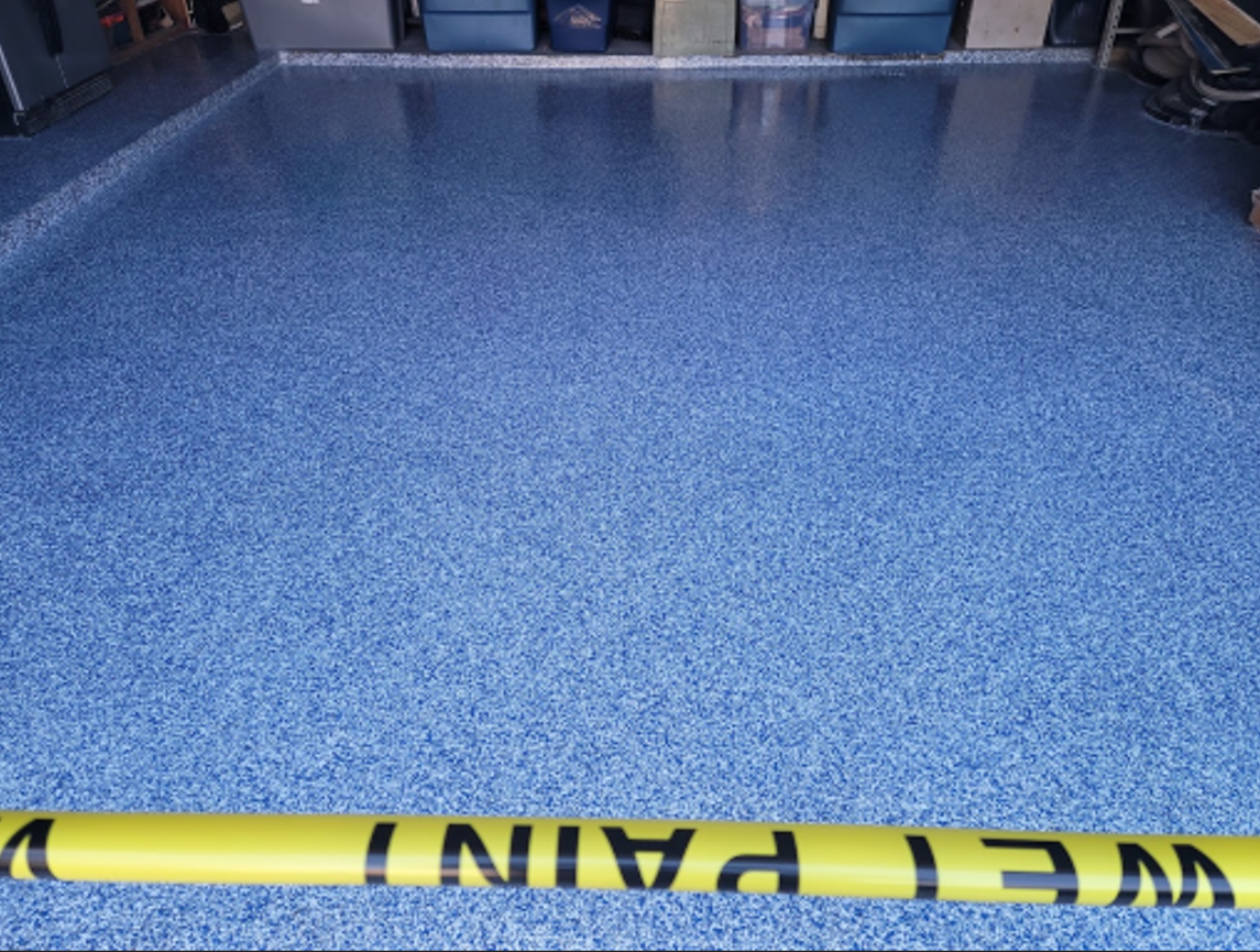 Blue speckled garage floor with yellow 
