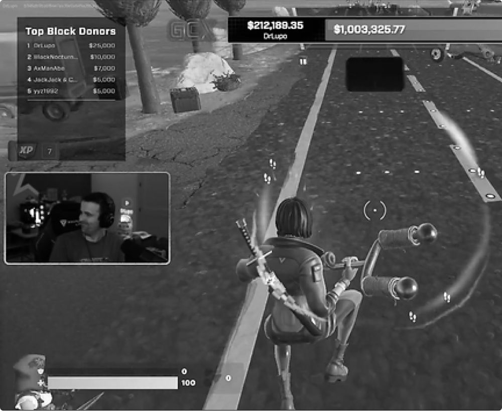 A person is streaming a video game. The game character rides a vehicle on a road with trees.