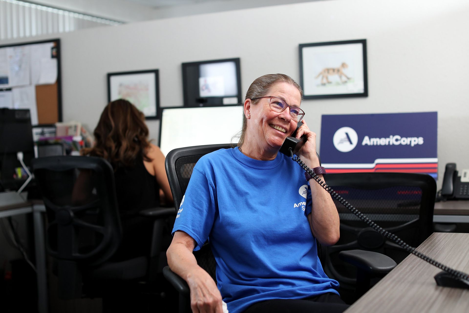 RSVP volunteer on a phone call at a volunteer station