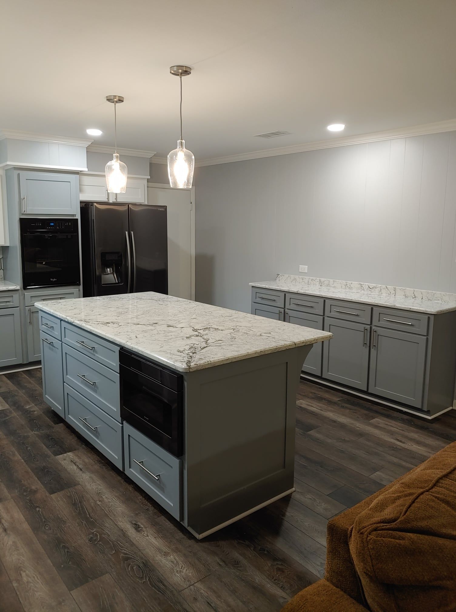 A kitchen with a large island in the middle of the room.